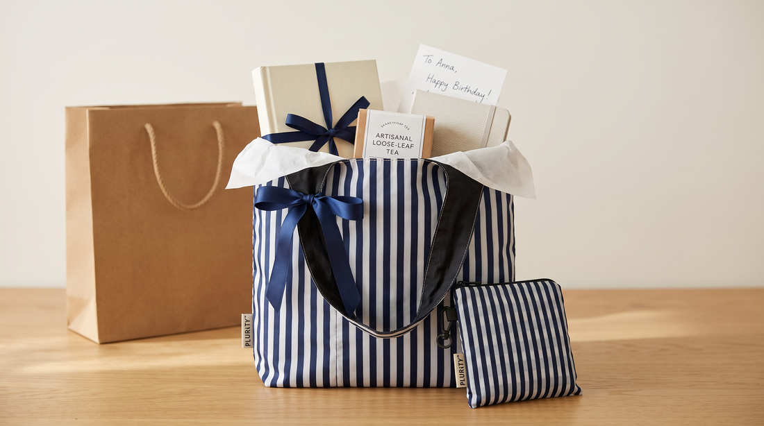 PLURiTy roll-up reusable tote used as reusable gift packaging with thoughtful gifts inside.