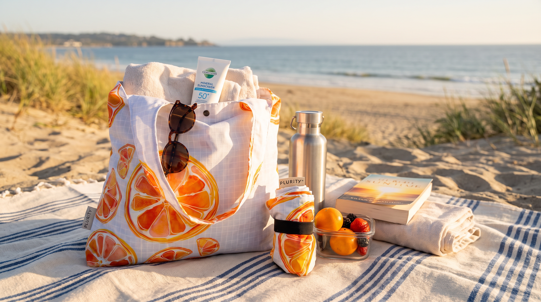 PLURiTy roll-up reusable tote with beach and picnic essentials and coordinating storage pouch.